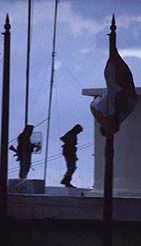 Guards silhouetted on rooftop